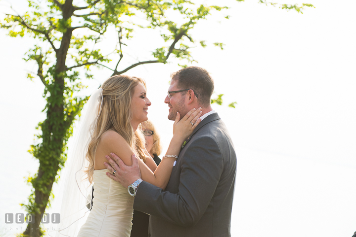 Bride and Groom almost kissed after officiant said You may now kiss the Bride. Kent Island Maryland Chesapeake Bay Beach Club wedding ceremony and getting ready photo, by wedding photographers of Leo Dj Photography. http://leodjphoto.com