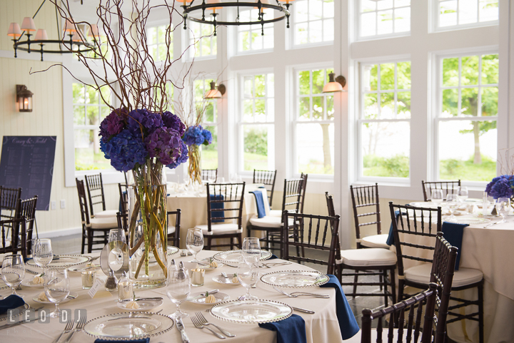 Purple, violet and blue hydrangeas table centerpiece by Cache Fleur. Kent Island Maryland Chesapeake Bay Beach Club wedding reception party photo, by wedding photographers of Leo Dj Photography. http://leodjphoto.com