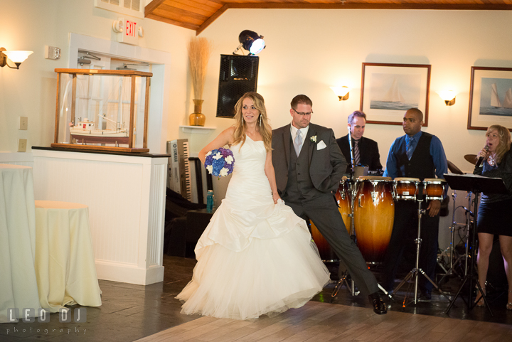 Bride and Groom introduced by the MC from Onyx Band entering the Tavern Ballroom. Kent Island Maryland Chesapeake Bay Beach Club wedding reception party photo, by wedding photographers of Leo Dj Photography. http://leodjphoto.com