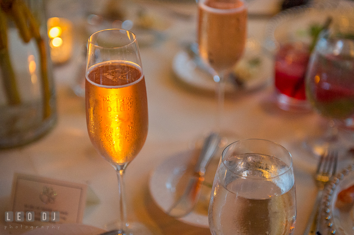 Bride and Groom's name engraved on their champagne glasses. Kent Island Maryland Chesapeake Bay Beach Club wedding reception party photo, by wedding photographers of Leo Dj Photography. http://leodjphoto.com