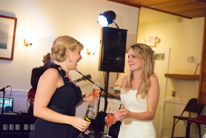 Bride gets teary eyed after Maid of Honor's toast speech. Kent Island Maryland Chesapeake Bay Beach Club wedding reception party photo, by wedding photographers of Leo Dj Photography. http://leodjphoto.com