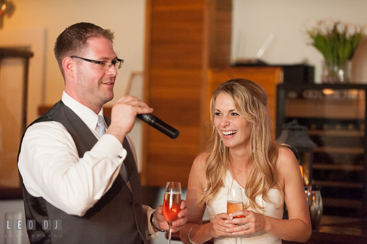 Bride laughing listening to Groom's speech. Kent Island Maryland Chesapeake Bay Beach Club wedding reception party photo, by wedding photographers of Leo Dj Photography. http://leodjphoto.com