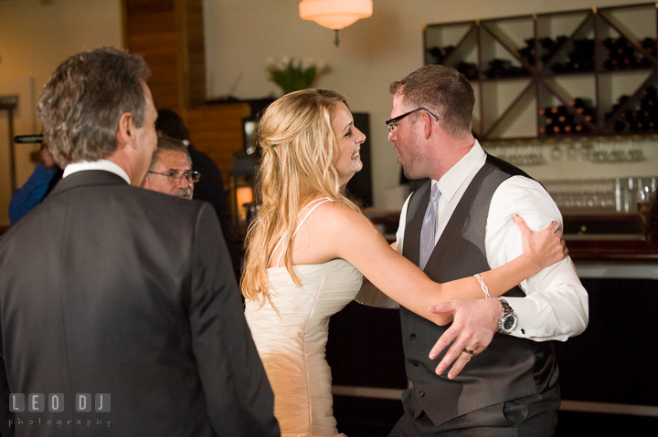 Bride holding Groom to stop his silliness. Kent Island Maryland Chesapeake Bay Beach Club wedding reception party photo, by wedding photographers of Leo Dj Photography. http://leodjphoto.com