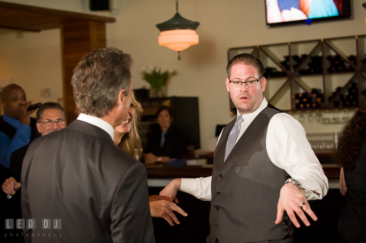 Groom doing silly dance, Bride and Father laughing. Kent Island Maryland Chesapeake Bay Beach Club wedding reception party photo, by wedding photographers of Leo Dj Photography. http://leodjphoto.com