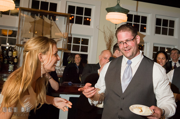 Groom realized that Bride was playing prank on him. Kent Island Maryland Chesapeake Bay Beach Club wedding reception party photo, by wedding photographers of Leo Dj Photography. http://leodjphoto.com