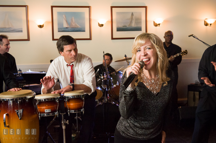 Female lead singer from Onyx band singing. Kent Island Maryland Chesapeake Bay Beach Club wedding reception party photo, by wedding photographers of Leo Dj Photography. http://leodjphoto.com