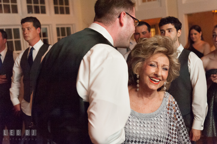 Grandmother and Groom laughing while dancing. Kent Island Maryland Chesapeake Bay Beach Club wedding reception party photo, by wedding photographers of Leo Dj Photography. http://leodjphoto.com