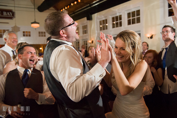 Bride and Groom dancing and laughing together. Kent Island Maryland Chesapeake Bay Beach Club wedding reception party photo, by wedding photographers of Leo Dj Photography. http://leodjphoto.com