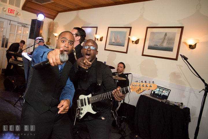 Onyx Band singer and guitarist performing together. Kent Island Maryland Chesapeake Bay Beach Club wedding reception party photo, by wedding photographers of Leo Dj Photography. http://leodjphoto.com