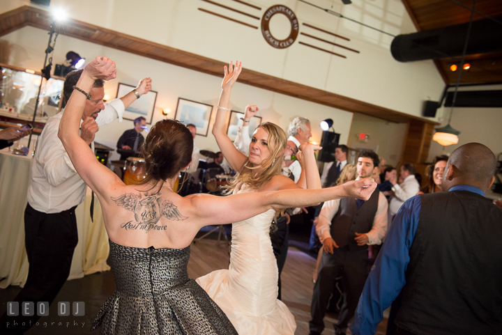 Bride dancing toghether with guest and Father. Kent Island Maryland Chesapeake Bay Beach Club wedding reception party photo, by wedding photographers of Leo Dj Photography. http://leodjphoto.com