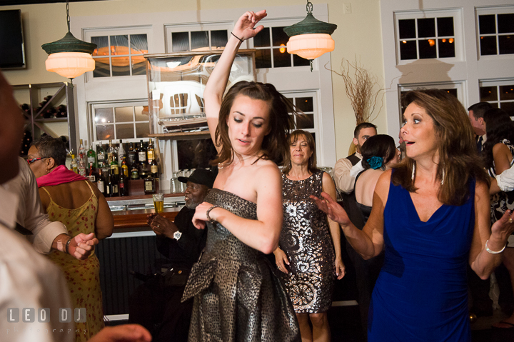Mother of Bride dancing together with a girl guest. Kent Island Maryland Chesapeake Bay Beach Club wedding reception party photo, by wedding photographers of Leo Dj Photography. http://leodjphoto.com