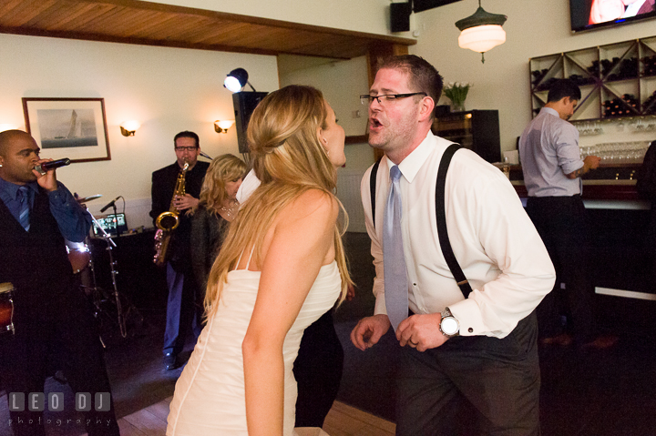 Bride and Groom singing together. Kent Island Maryland Chesapeake Bay Beach Club wedding reception party photo, by wedding photographers of Leo Dj Photography. http://leodjphoto.com