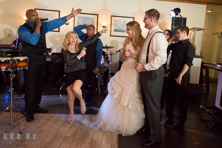 Onyx Band singers doing their final performance and announced the Bride and Groom again. Kent Island Maryland Chesapeake Bay Beach Club wedding reception party photo, by wedding photographers of Leo Dj Photography. http://leodjphoto.com