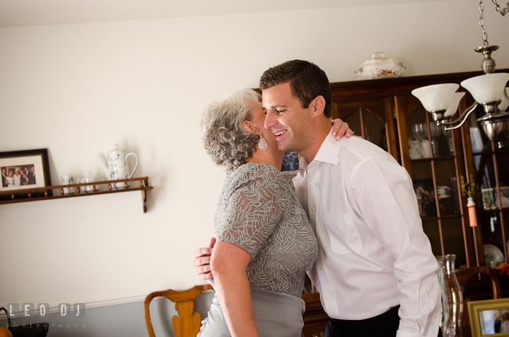 Mother of Groom hugged her son. Getting ready wedding photos at Baltimore Marriott Waterfront by photographers of Leo Dj Photography. http://leodjphoto.com