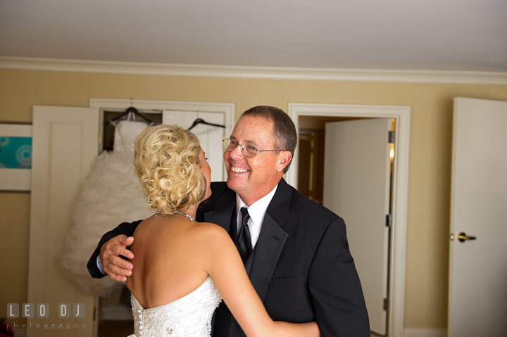 Father of Bride hugging daughter. Getting ready wedding photos at Baltimore Marriott Waterfront by photographers of Leo Dj Photography. http://leodjphoto.com