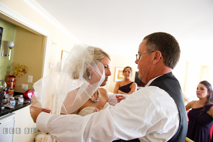 Father of Bride practice open daughter's veil. Getting ready wedding photos at Baltimore Marriott Waterfront by photographers of Leo Dj Photography. http://leodjphoto.com