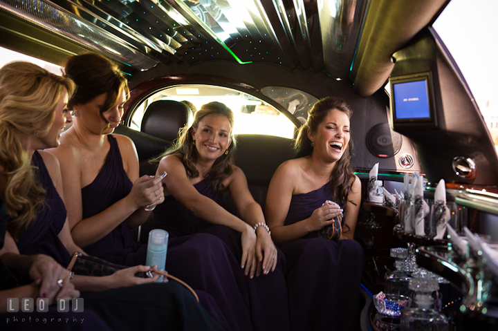 Maid of Honor and Bridesmaids laughing and having fun inside the limo. Getting ready wedding photos at Baltimore Marriott Waterfront by photographers of Leo Dj Photography. http://leodjphoto.com