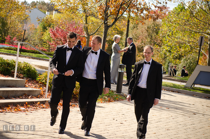 Groom and Groomsmen walking toward church. Ceremony wedding photos at Sacred Heart Church, Glyndon, Maryland by photographers of Leo Dj Photography. http://leodjphoto.com