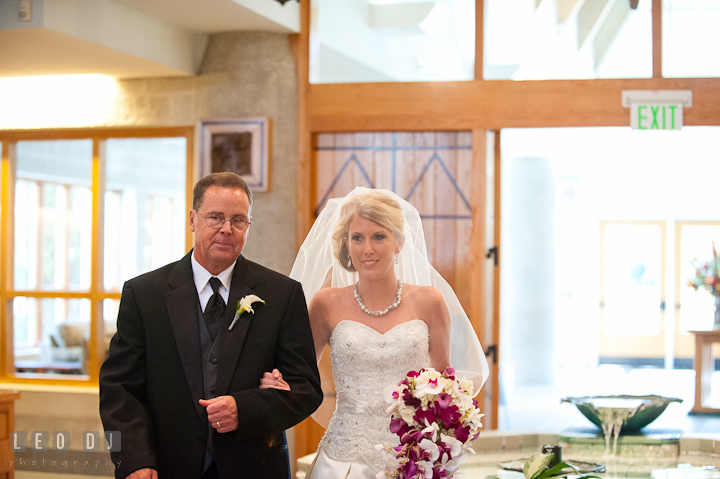 Father of the Bride escorting daughter walking down the isle. Ceremony wedding photos at Sacred Heart Church, Glyndon, Maryland by photographers of Leo Dj Photography. http://leodjphoto.com