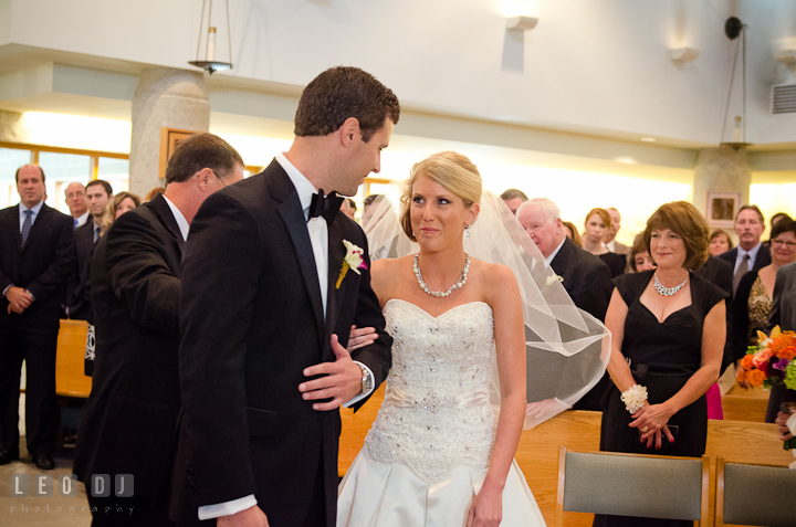 Father of Bride gave away daughter to Groom. Ceremony wedding photos at Sacred Heart Church, Glyndon, Maryland by photographers of Leo Dj Photography. http://leodjphoto.com