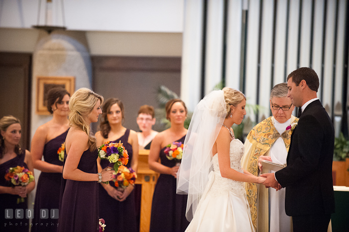 Bride and Groom exchanging wedding rings. Ceremony wedding photos at Sacred Heart Church, Glyndon, Maryland by photographers of Leo Dj Photography. http://leodjphoto.com