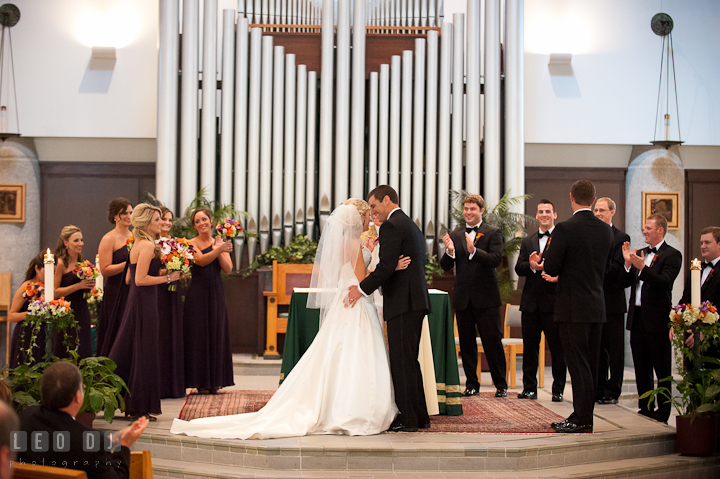 Bride and Groom kissed after they're officially announced. Ceremony wedding photos at Sacred Heart Church, Glyndon, Maryland by photographers of Leo Dj Photography. http://leodjphoto.com