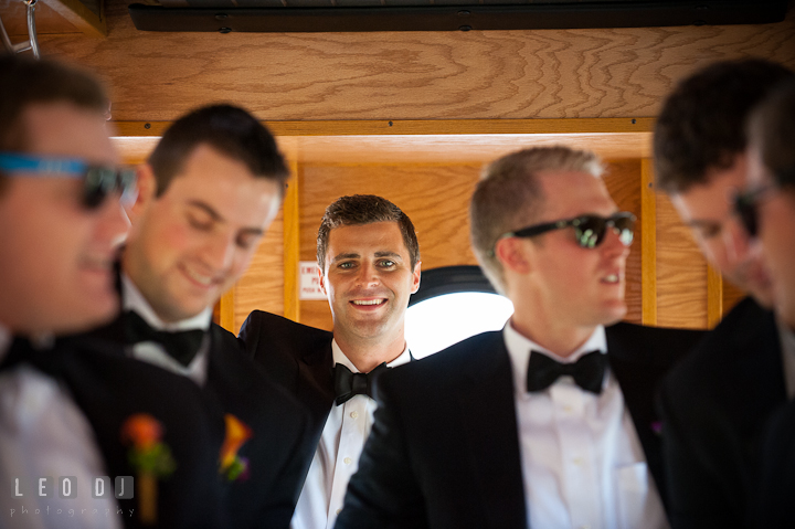 Groom posing with Best Man and Groomsmen inside trolley bus. Baltimore Museum of Industry wedding photos by photographers of Leo Dj Photography. http://leodjphoto.com