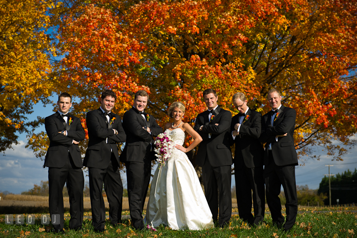 The beautiful Bride posing with all the handsome Best Man and Groomsmen. Baltimore Museum of Industry wedding photos by photographers of Leo Dj Photography. http://leodjphoto.com