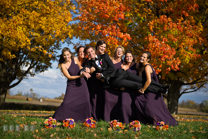 The handsome Groom posing with the beautiful Matron of Honor and Bridesmaids. Baltimore Museum of Industry wedding photos by photographers of Leo Dj Photography. http://leodjphoto.com