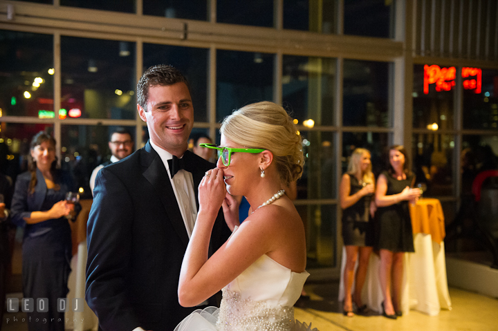 Bride wearing funny sun glasses laughing with groom. Baltimore Museum of Industry wedding photos by photographers of Leo Dj Photography. http://leodjphoto.com