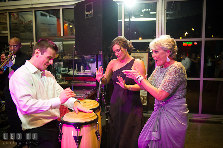 Groom's cousin play conga while Groom's mother and sister danced. Baltimore Museum of Industry wedding photos by photographers of Leo Dj Photography. http://leodjphoto.com