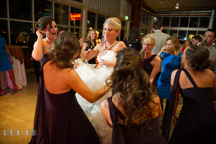 Bridesmaids and Maid of Honor flapped Bride's dress. Baltimore Museum of Industry wedding photos by photographers of Leo Dj Photography. http://leodjphoto.com