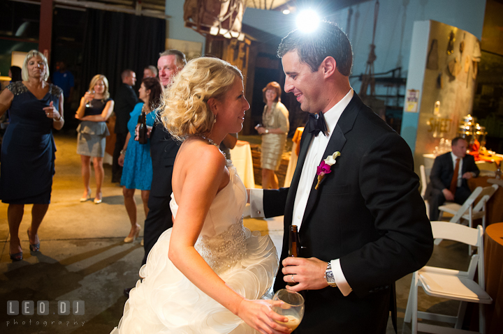 Bride and Groom smiling while dancing. Baltimore Museum of Industry wedding photos by photographers of Leo Dj Photography. http://leodjphoto.com