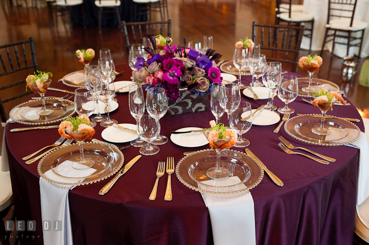 Dinner table set up with mimosa and blue and purple flower centerpiece. Chesapeake Bay Beach Club wedding bridal testing photos by photographers of Leo Dj Photography. http://leodjphoto.com