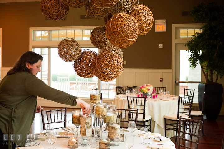 Sarah Campbell-Angers of  Intrige Design and Decor applying finishing touch to table centerpiece. Chesapeake Bay Beach Club wedding bridal testing photos by photographers of Leo Dj Photography. http://leodjphoto.com