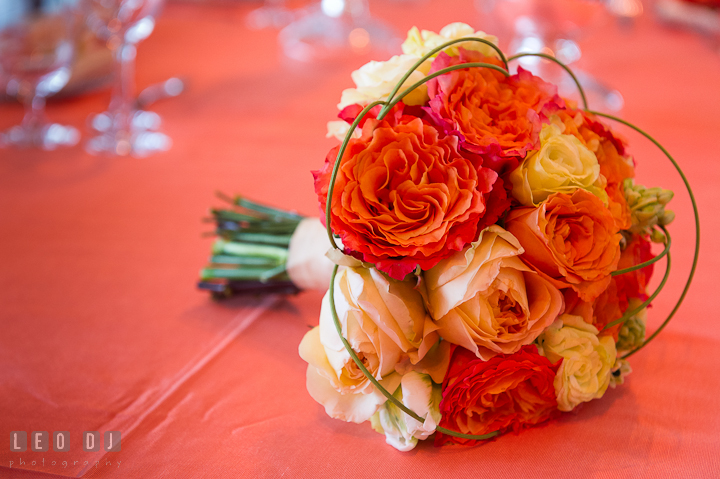 Orange floral bouquet by Intrige Design and Decor. Chesapeake Bay Beach Club wedding bridal testing photos by photographers of Leo Dj Photography. http://leodjphoto.com