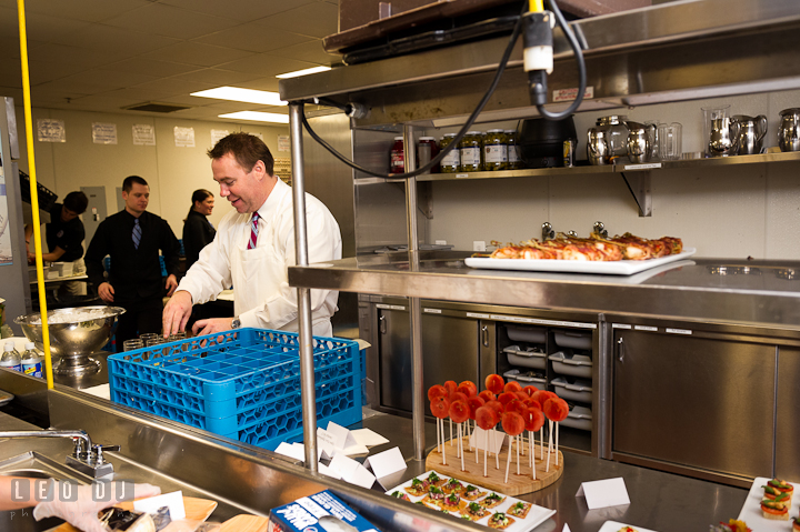 Kitchen staff and general manager preparing finger food and drinks for cocktail hour. Chesapeake Bay Beach Club wedding bridal testing photos by photographers of Leo Dj Photography. http://leodjphoto.com