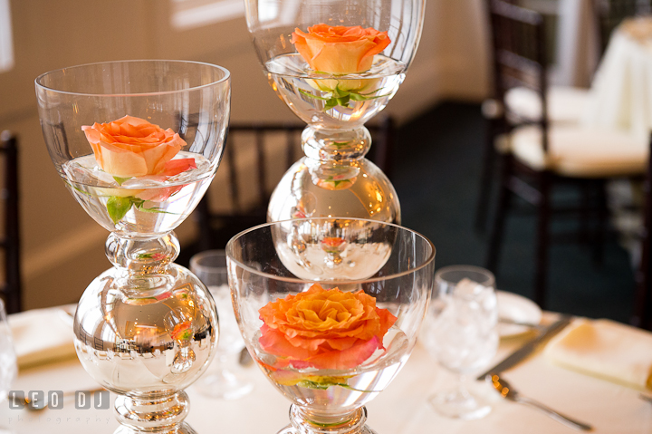 Glass and silver vase with orange rose table centerpieces by Intrige Design and Decor. Chesapeake Bay Beach Club wedding bridal testing photos by photographers of Leo Dj Photography. http://leodjphoto.com