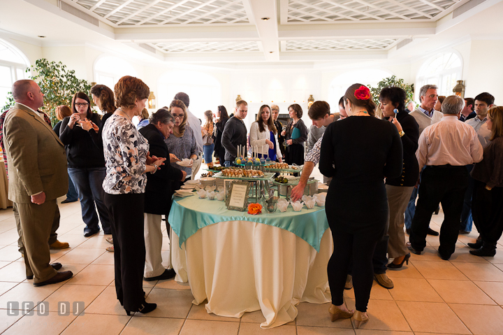 Groom and bride's to-be, and guests trying out the deserts. Chesapeake Bay Beach Club wedding bridal testing photos by photographers of Leo Dj Photography. http://leodjphoto.com