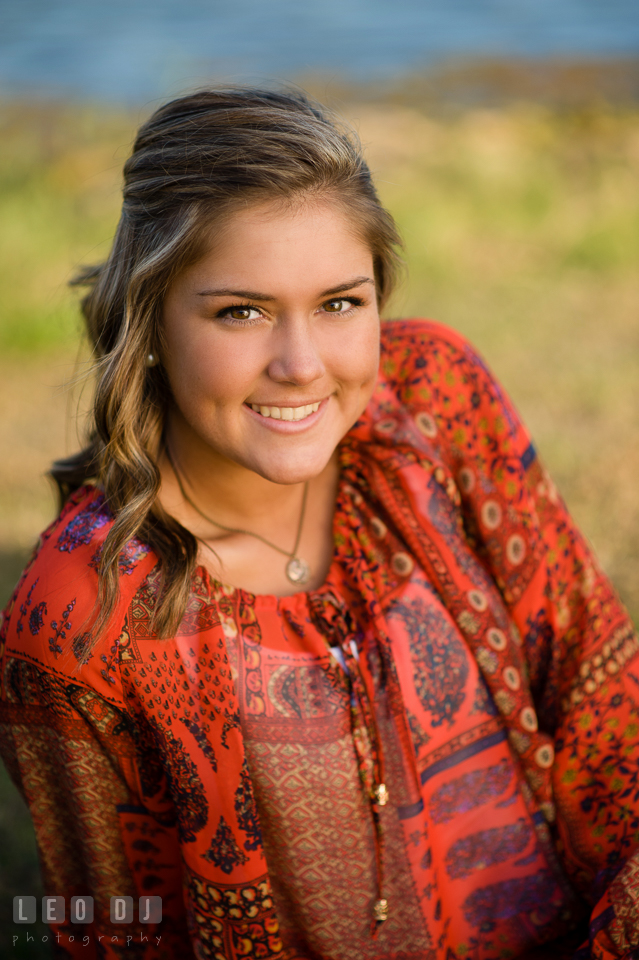 Beautiful girl with dimples in red blouse. Eastern Shore, Maryland, Queen Anne's County High School senior portrait session by photographer Leo Dj Photography. http://leodjphoto.com