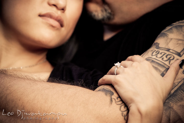Engagement ring shown with her fiancee's tattoo. Eastern Shore MD engagement pre-wedding photo session pier boat tattoo