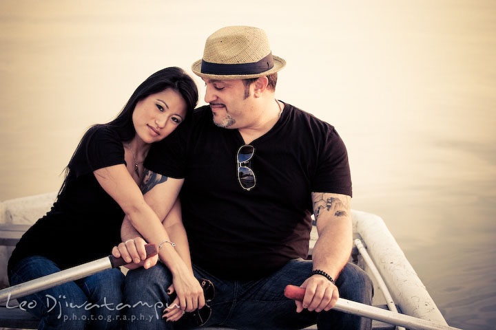 Engaged girl leaning her head on fiancee's shoulder, enjoying the moment. Eastern Shore MD engagement pre-wedding photo session pier boat tattoo