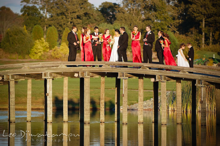 Bride groom and the bridal and groom party on a bridge. Baywood Clubhouse at Baywood Greens Wedding, St. Christophers Church Wedding, Kent Island, Eastern Shore Maryland
