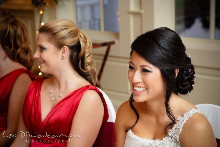 Bride and maid of honor laughing listening to groom's speech. Baywood Clubhouse at Baywood Greens Wedding, St. Christophers Church Wedding, Kent Island, Eastern Shore Maryland