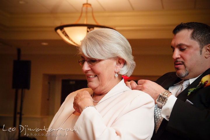Groom puting necklace gift on his mother. Baywood Clubhouse at Baywood Greens Wedding, St. Christophers Church Wedding, Kent Island, Eastern Shore Maryland