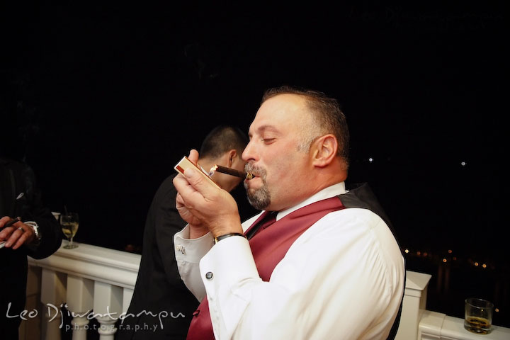 Best man lighting up his cigar. Baywood Clubhouse at Baywood Greens Wedding, St. Christophers Church Wedding, Kent Island, Eastern Shore Maryland