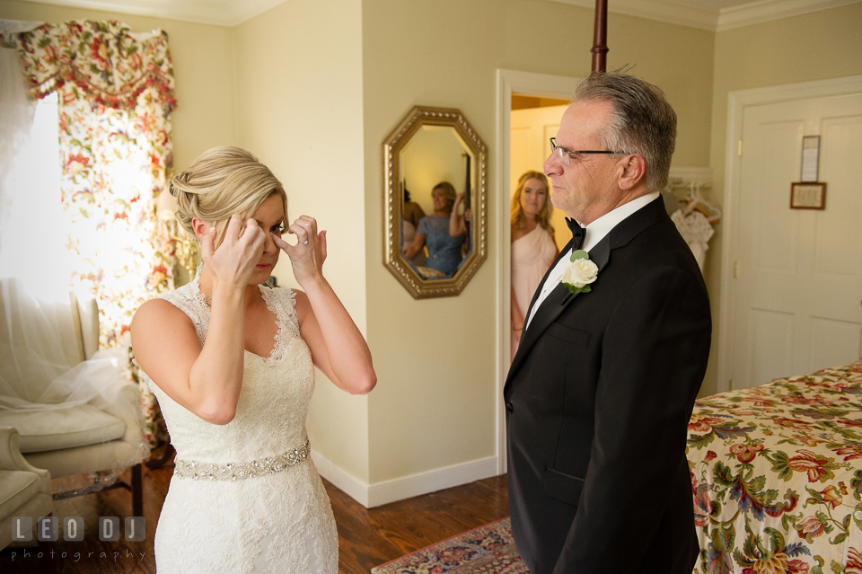 Kent Island Maryland bride wiping off tears during first look with Dad photo by Leo Dj Photography