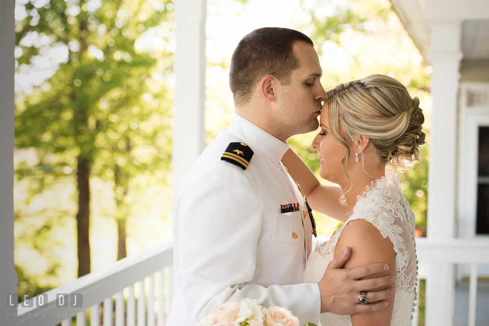 Kent Manor Inn groom kissed bride during first look photo by Leo Dj Photography