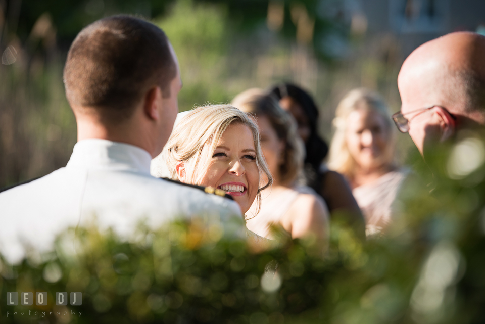 Kent Manor Inn bride laughing during wedding ceremony photo by Leo Dj Photography