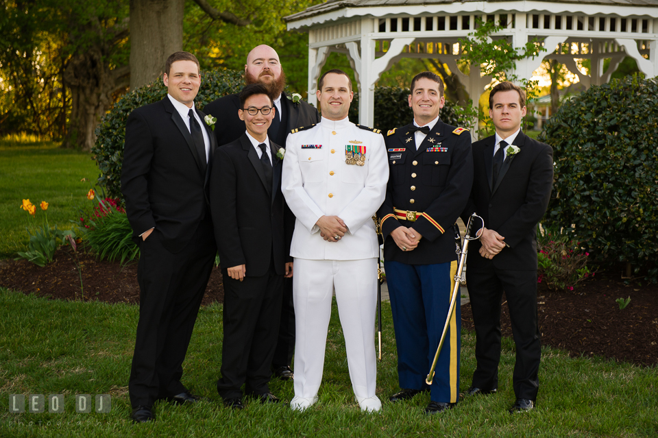 Kent Manor Inn Groom, Best Man, and Groomsmen posing by the gazebo photo by Leo Dj Photography